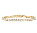 Gold bracelet with diamond accents on a white background
