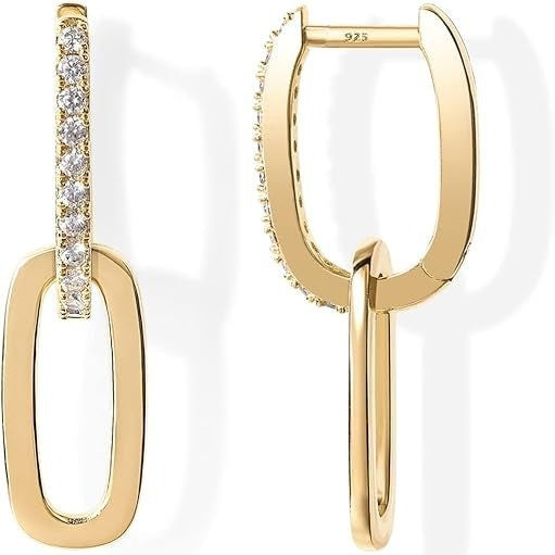 Gold hoop earrings with clear gemstones on a white background