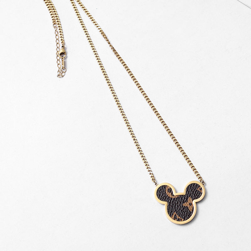 Necklace with a Mickey Mouse head pendant on a white background