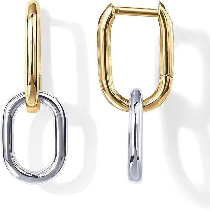 Pair of gold and silver hoop earrings on a white background