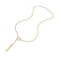 Gold necklace with a bar pendant on a white background
