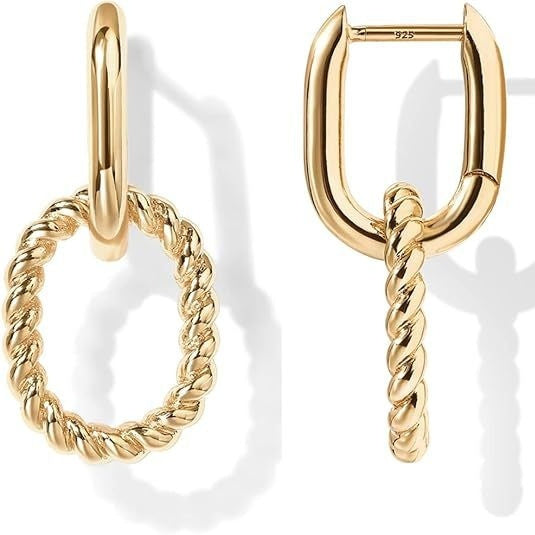 Gold hoop earrings with twisted design on a white background