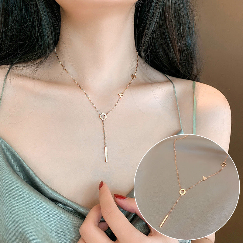 Woman wearing a delicate gold necklace with a close-up inset showing the necklace details.