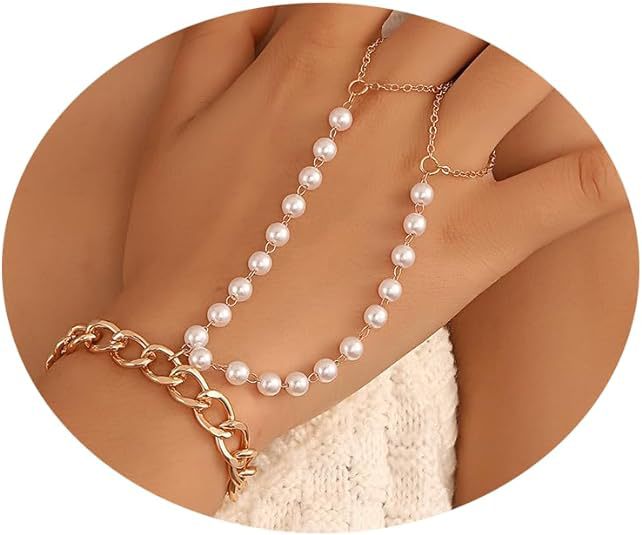 Pearl necklace and bracelet set on a person's wrist with a neutral background