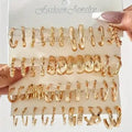 Set of gold hoop earrings on a 'Fashion Jewelry' card held by a hand.