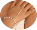 Pearl anklet on a person's ankle with a blurred background