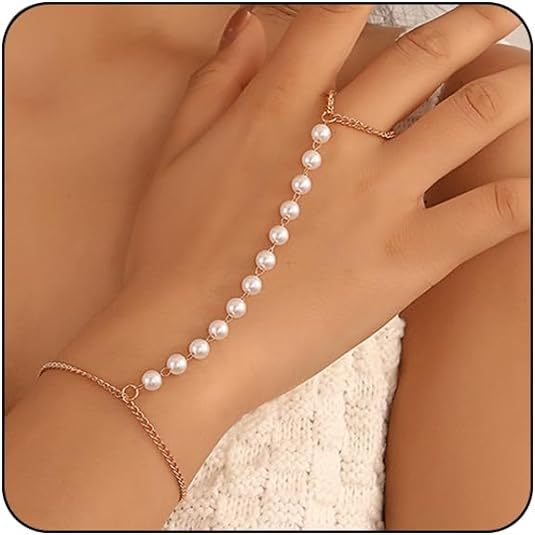 Pearl bracelet on a hand with a neutral background