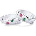 Pair of silver rings with gemstones on a white background
