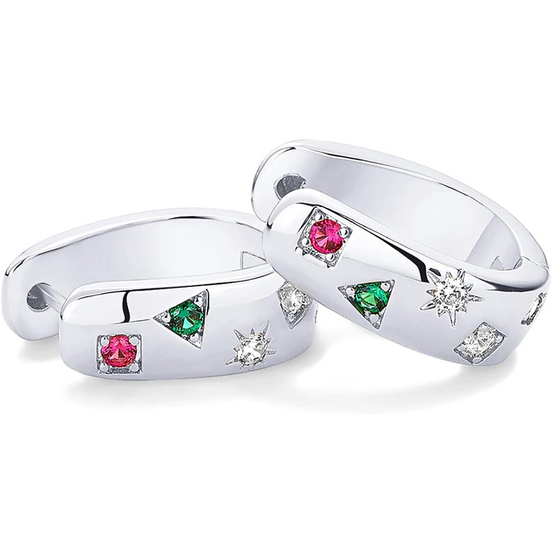 Pair of silver rings with gemstones on a white background