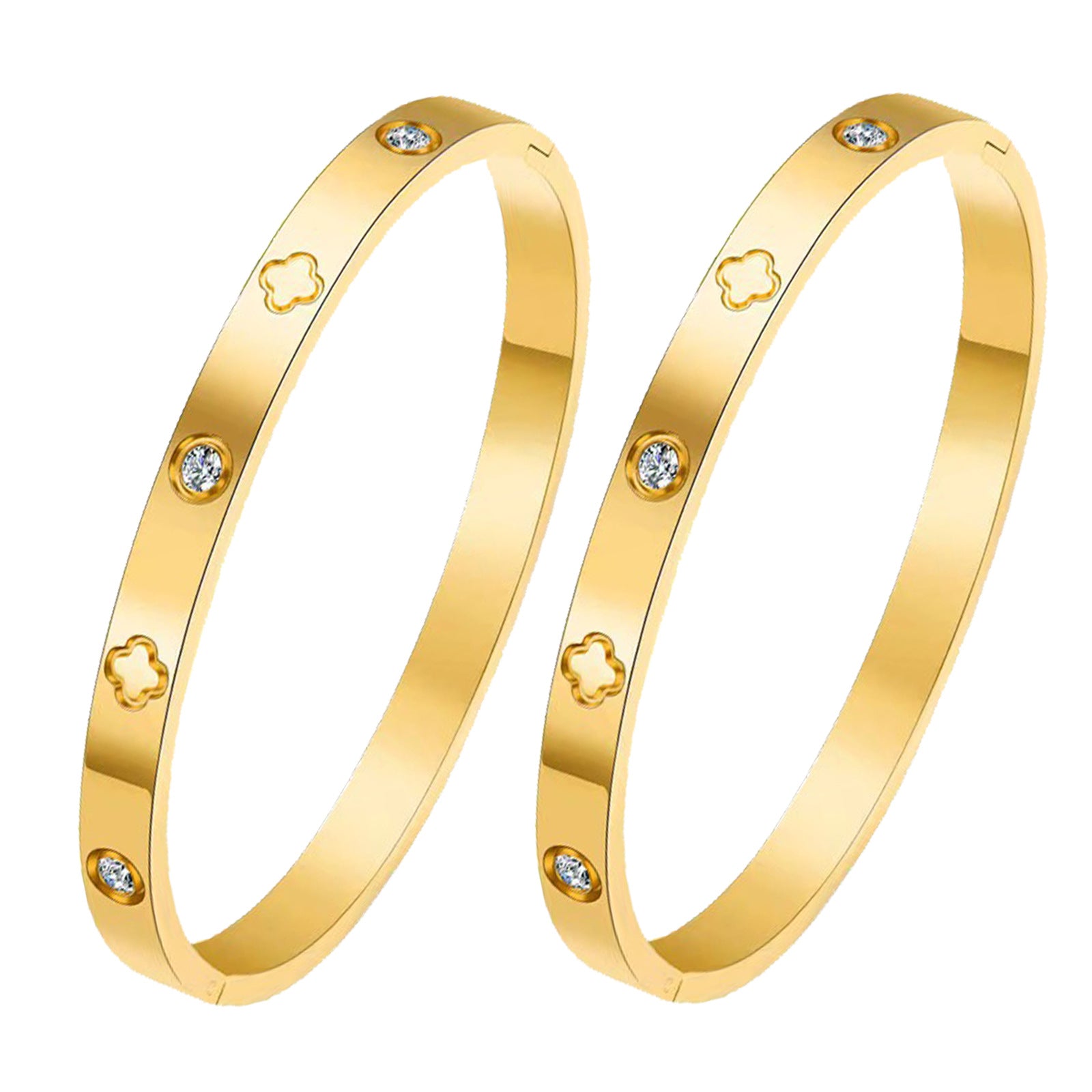 Two gold bangles with clover and gemstone accents on a white background
