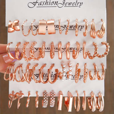 Rose gold hoop earrings displayed on a card with 'Fashion Jewelry' branding.
