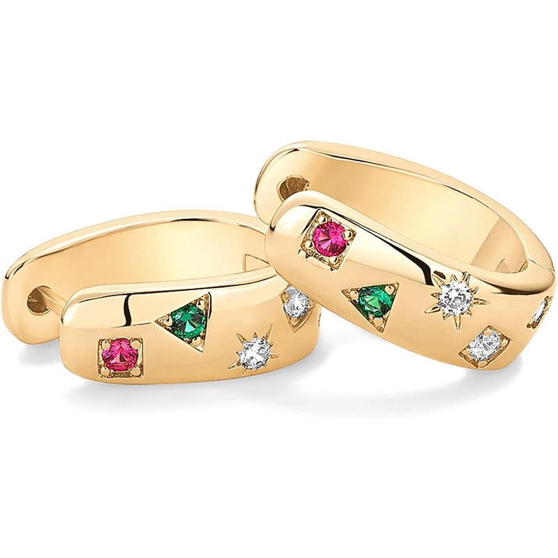 Two gold rings with gemstones on a white background