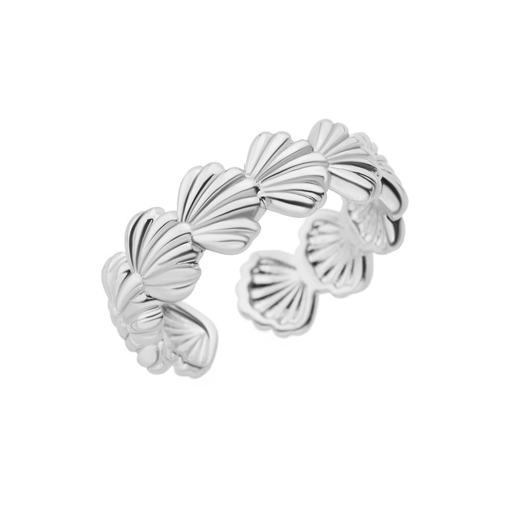 Silver ring with shell design on a white background