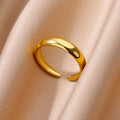 Gold ring on a soft beige fabric background