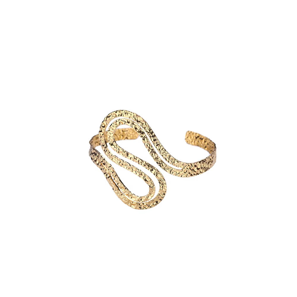 Gold ring with a textured design on a white background