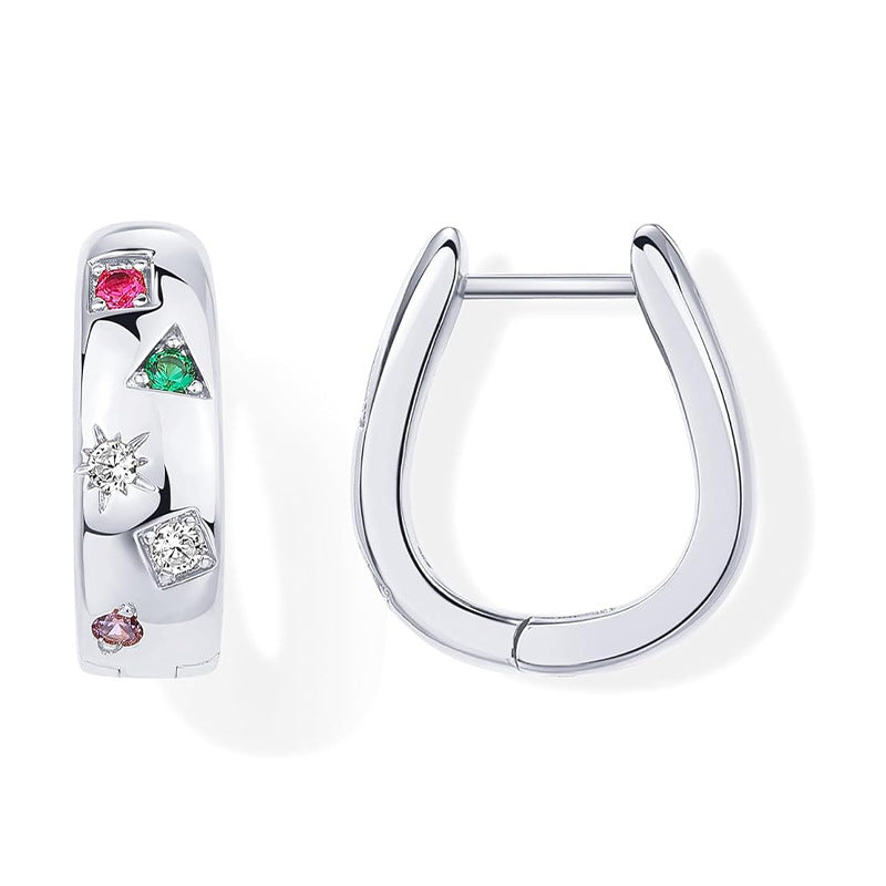 Silver hoop earrings with gemstone accents on a white background