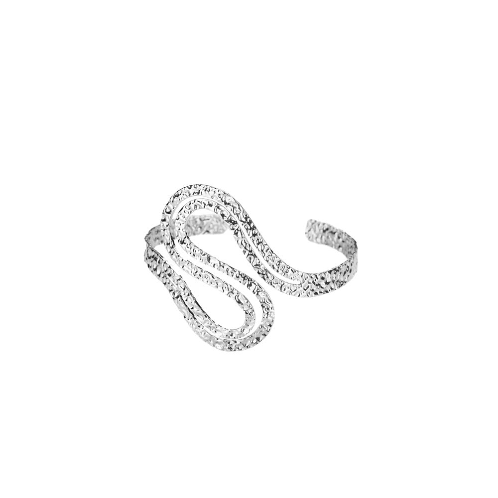 Silver ring with a twisted design on a white background