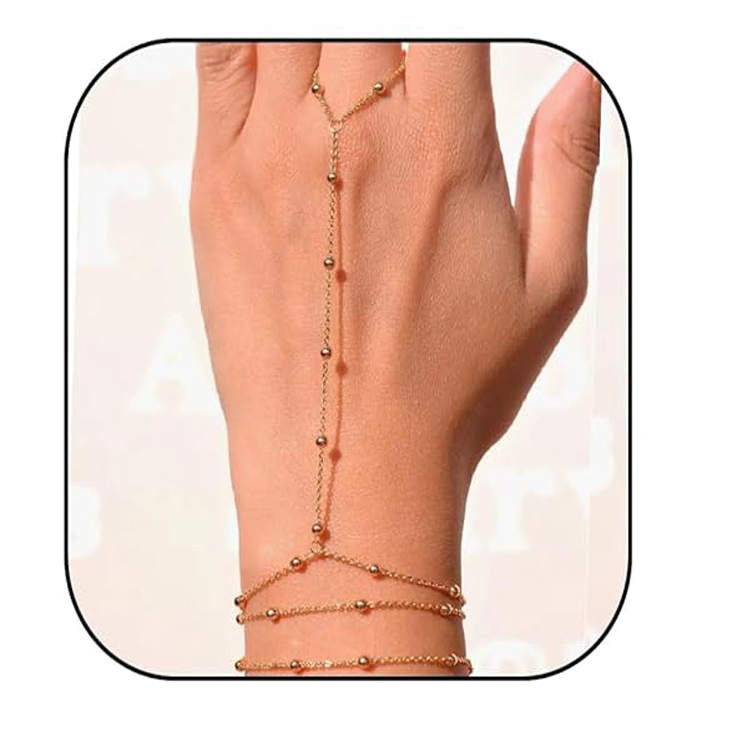 Gold hand chain on a hand with a white background