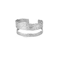 Silver cuff bracelet on a white background