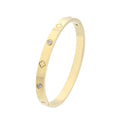 Gold bracelet with diamond accents on a white background