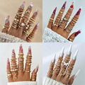 Collage of multiple gold rings on fingers with various nail colors.